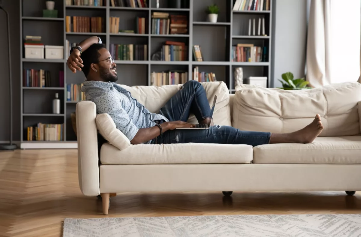 Man lounging on couch